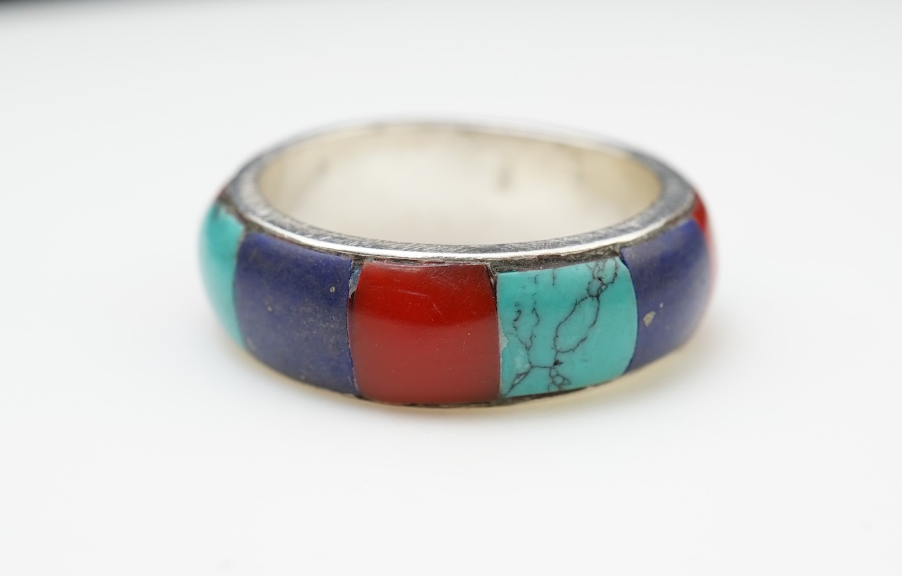 A collection of silver jewellery including a Zuni bangle